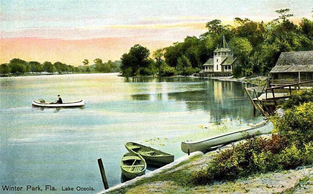 Vintage color postcard of Lake Osceola in Winter Park with a rowboat and boathouse